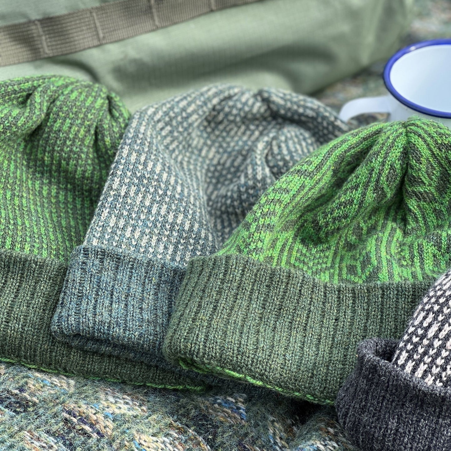 Our knitted woollen beanie hats are made from the finest Merino lamb’s wool, and hand framed, seen here in Juniper and Moss