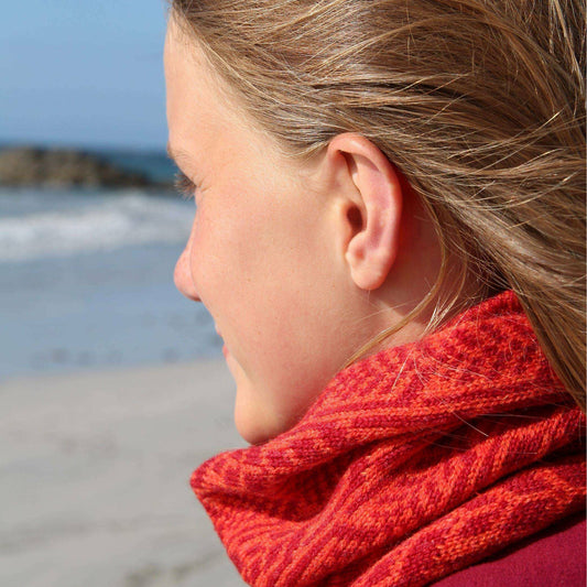 Our scarves and neck warmers are all knitted using a punch-card system on a manual vintage knitting machine and made from pure Merino lamb's wool, with bespoke two-colour fair isle patterns unique to Hebridean Journey. This colour is Rust.