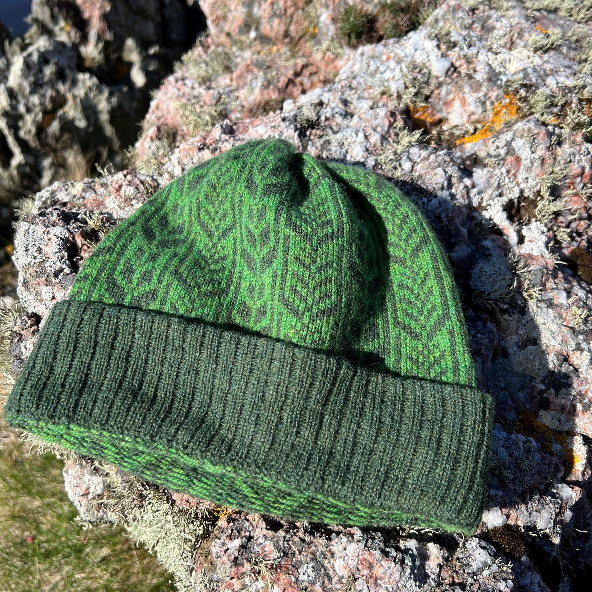 Beanie hat in pure merino lambs wool, hand framed on a vintage knitting machine, Tiree barley pattern in juniper green